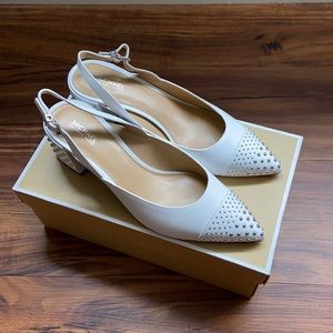 White sling back pumps with stud detailing